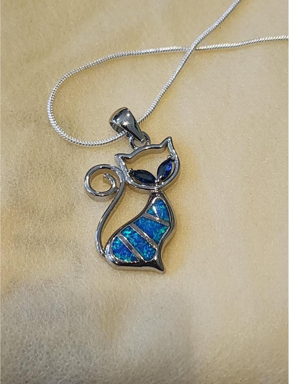 Blue.
Fire opal- sterling silver 925 - cat pendant